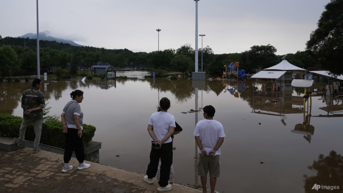 Thirty dead in Beijing following heavy rain Thirty dead in Beijing following heavy rain