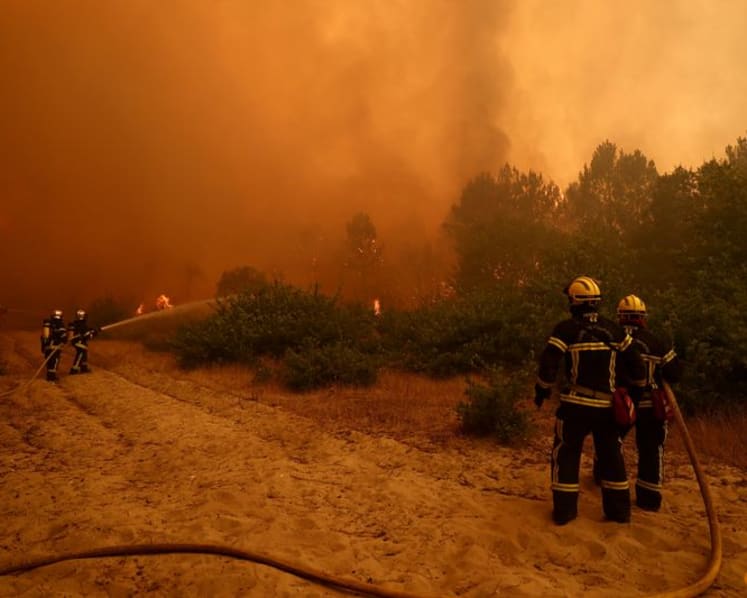 Over 100,000 flee or hole up indoors as wildfires rage in France and Spain
