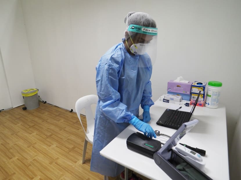 A medical worker at a community care facility in Changi Exhibition Centre. The authorities are reminding workers at such facilities about infection control and refreshing their knowledge in this area.