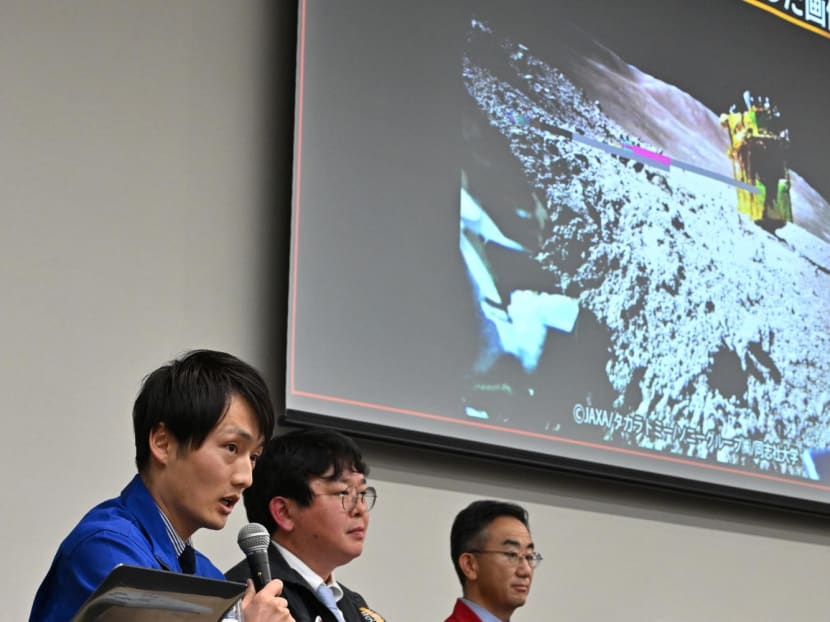 Daichi Hirnao (L), associate senior researcher at JAXA's Space Exploration Innovation Hub Center, explains an image of the lunar surface taken and transmitted by LEV-2 "SORA-Q" the transformable lunar surface robot on Jan 25, 2024.