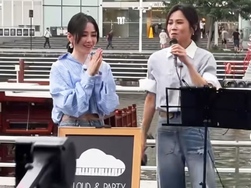 Singers Tanya Chua and Jane Zhang seen 'busking' at Clarke Quay