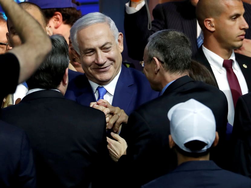 Israeli Prime Minister Benjamin Netanyahu is greeted by supporters of his Likud party as he arrives to speak following the announcement of exit polls in Israel's parliamentary election at the party headquarters in Tel Aviv, Israel, April 10, 2019. Israeli Prime Minister Benjamin Netanyahu is greeted by supporters of his Likud party as he arrives to speak following the announcement of exit polls in Israel's parliamentary election at the party headquarters in Tel Aviv, Israel, April 10, 2019.