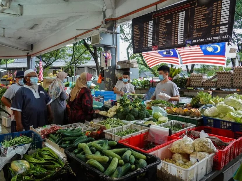 People shop for fresh produce at a morning market in Seksyen 6, Shah Alam on Oct 3, 2020.