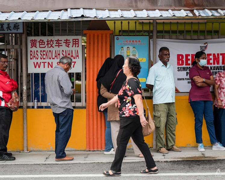 Hopes, frustration and resolve on display as voting kicks off to a slow start in Malaysian state polls 