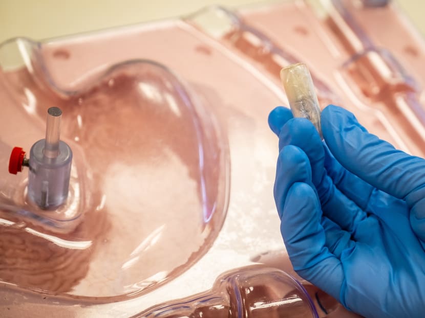 Researchers are working on a prototype of a weight-loss capsule (pictured). When swallowed, a balloon within can be inflated with a handheld magnet.