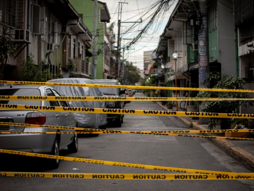 A view shows a makeshift barrier set up on a street of a village under lockdown amid rising Covid-19 infections, in Manila, Philippines on March 12, 2021.