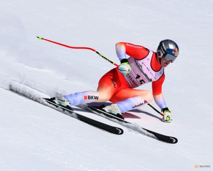 Alpine skiing-Von Allmen heads to Olympics with a win, Odermatt fourth