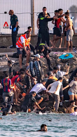 Spain sends troops after hundreds of migrants breach border with Morocco