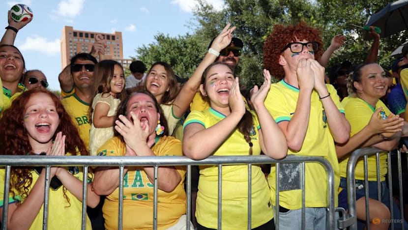 Heat no problem for passionate Brazil fans waiting to greet team in Houston