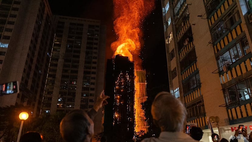 Man who ran onto track at Hong Kong's richest horse race to protest deadly fire released on bail