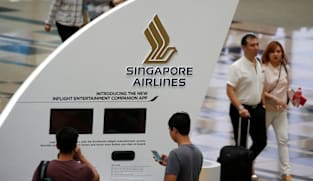 Singapore Airlines flags surging fuel costs; annual profit halves on one-offs