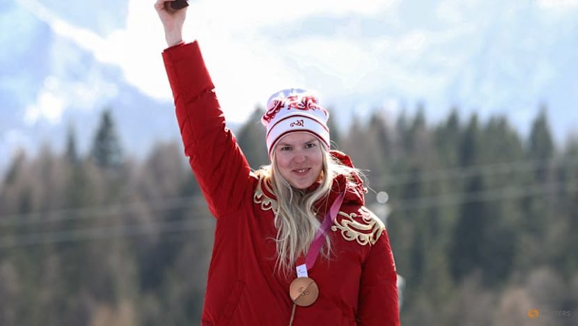Russian flag returns to Games podium with two downhill bronzes