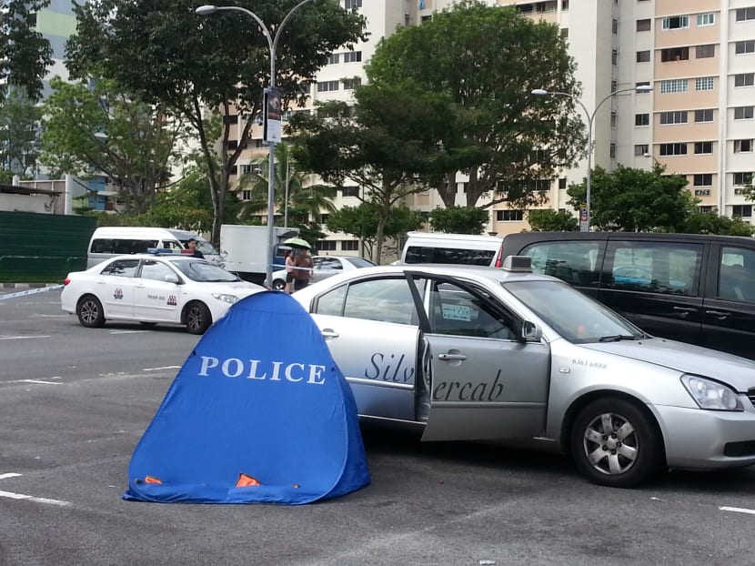 A man in his 50s was found motionless at a car park along Pasir Ris Close on July 15, 2014. He was pronounced dead at the scene. Photo: Ernest Chua