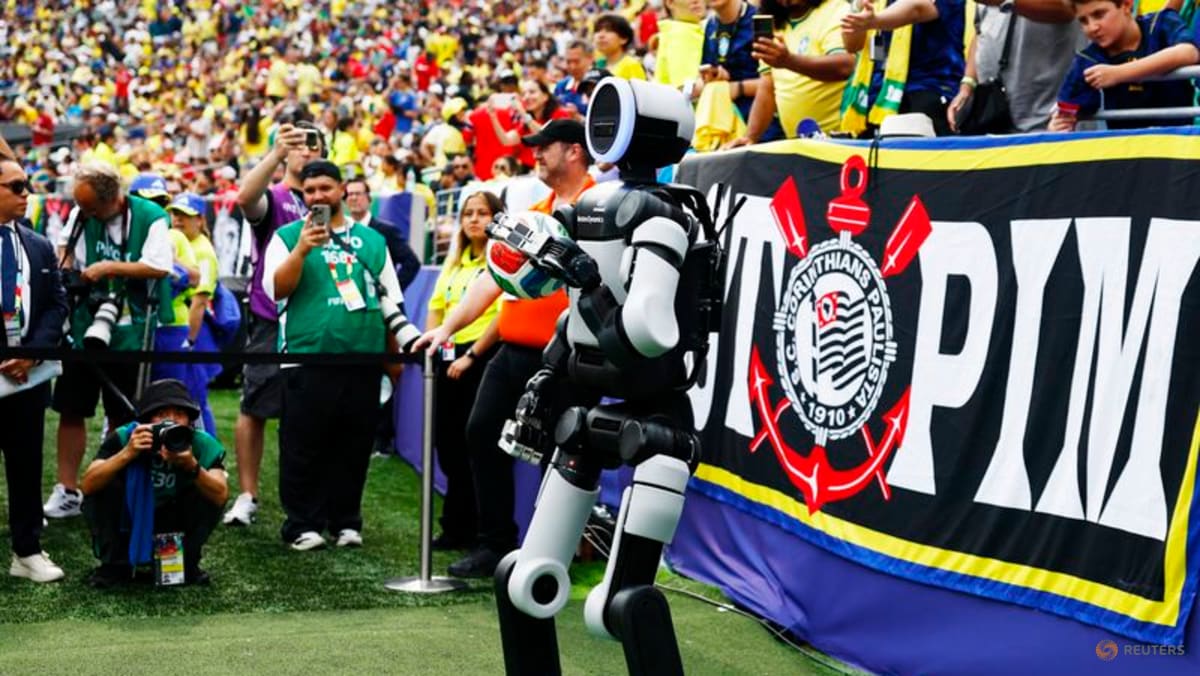 Atlas, the humanoid robot, delivers match ball at World Cup