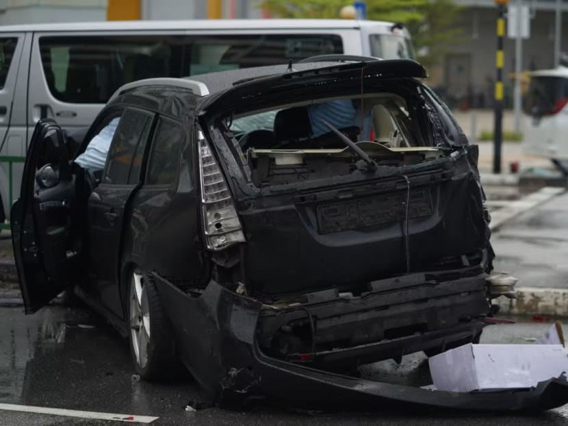 A damaged car is seen at the junction of Tampines Avenue 1 and Tampines Avenue 4 on April 22, 2024, after an accident. A damaged car is seen at the junction of Tampines Avenue 1 and Tampines Avenue 4 on April 22, 2024, after an accident.