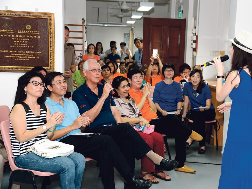 Mr Goh (seated, in dark blue) participating in a sing-along session at a celebration to mark the International Day of Older Persons at Marine Parade’s Foo Hai Elderly Lodge. Photo: National Council of Social Service