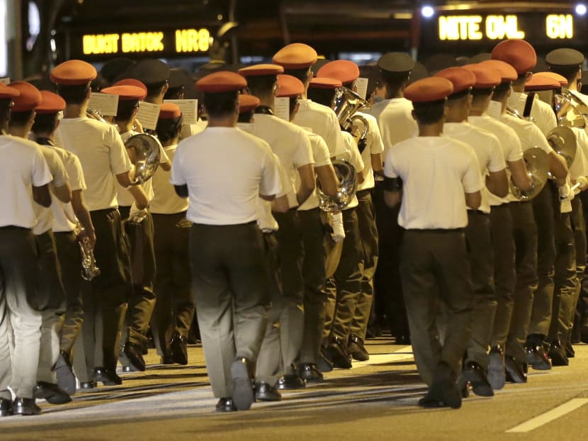 Military and police personnel in rehearsal yesterday (March 27) for the procession. They will be in full regalia tomorrow. Photo: Mugilan Rajasegeran