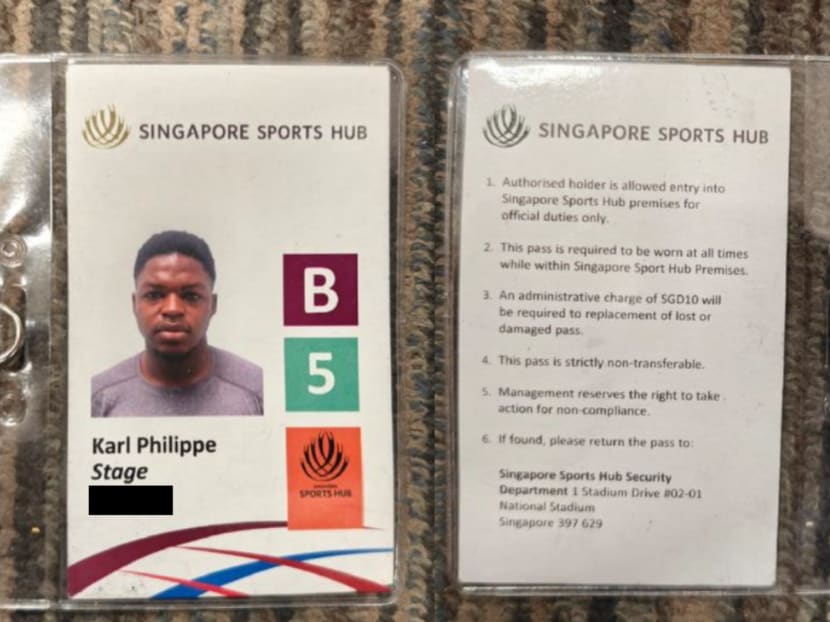 The front and back of the forged Singapore Sports Hub pass for workers that a man from Cameroon made in Singapore.
