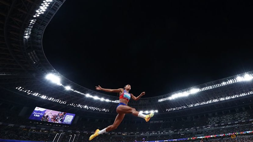 Davis-Woodhall adds world long jump title to Olympic crown