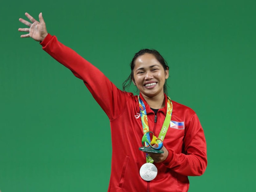 Hidilyn Diaz waving to the crowd after winning her silver medal. Photo: Getty Images
