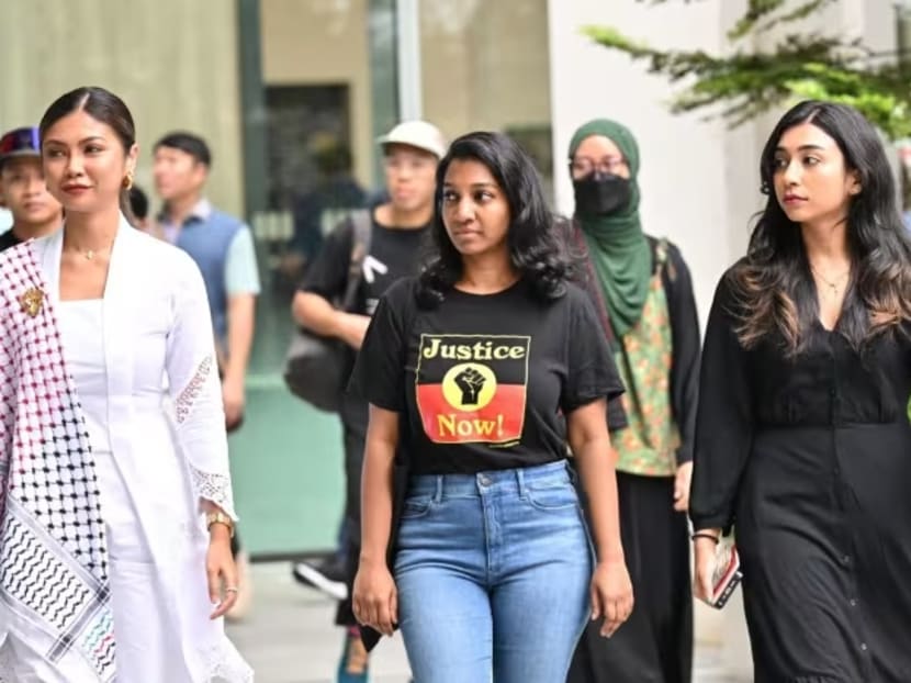 (From left) Siti Amirah Mohamed Asrori, Annamalai Kokila Parvathi and Mossamad Sobikun Nahar walking together in a group at the State Courts on June 27, 2024.