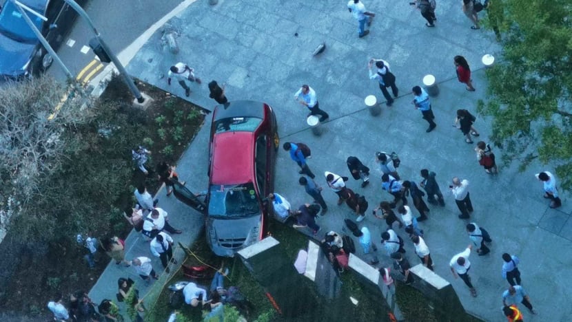 Four people in hospital after car mounts pavement at Marina Bay Financial Centre; driver arrested