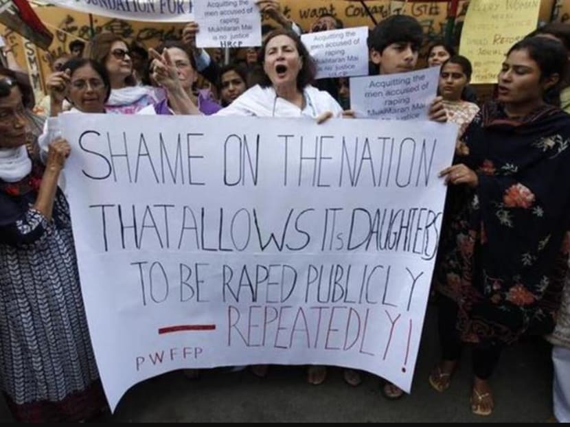 Activists hold a banner during a protest rally in Karachi.