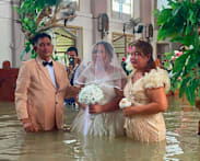 Philippine couple married in hip-deep floodwaters