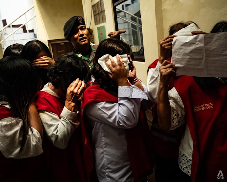 Indonesia baby trafficking trial begins for 19 people accused of sending at least 10 newborns to Singapore