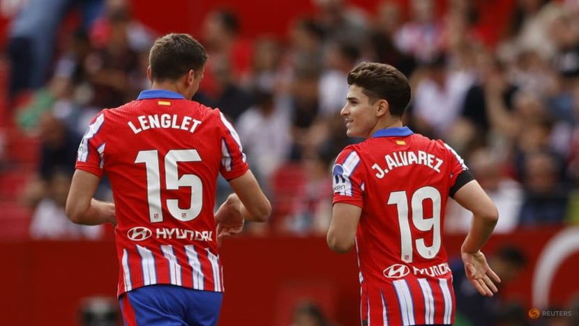 Atletico back to winning ways with last-gasp 2-1 victory at Sevilla