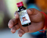 Indian police arrest owner of cough syrup company linked to deaths of 21 children