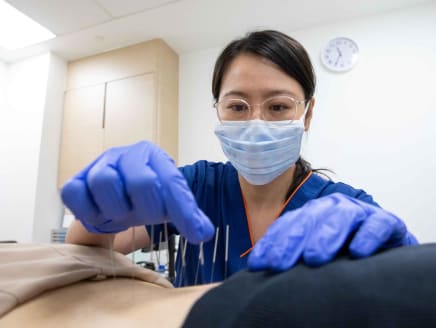 Senior acupuncturist Adele Lau from Sengkang General Hospital photographed at work on May 20, 2024.