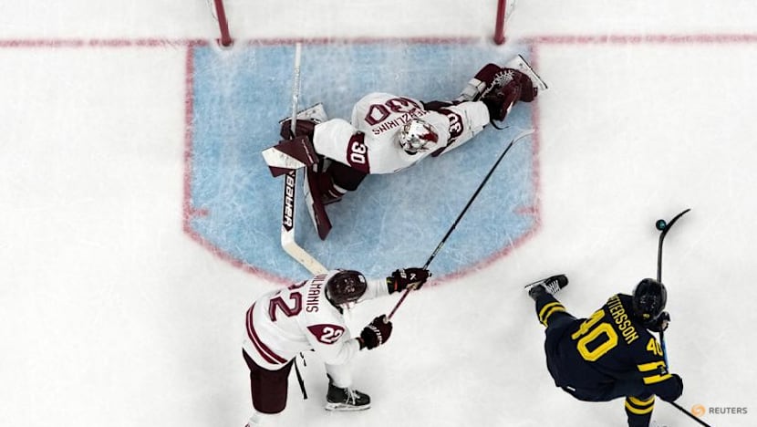 Ice hockey-Sweden beat Latvia to set men's quarter-final meeting with US
