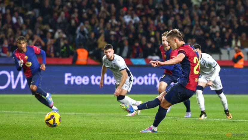 Barcelona ease past Osasuna to go three points clear