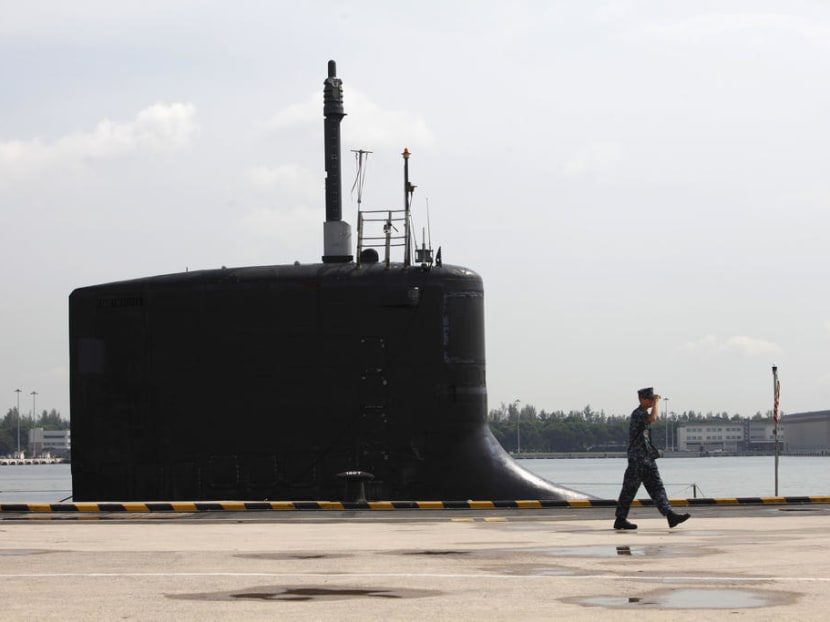 A file photo of a US Navy personnel walking past USS North Carolina, a nuclear powered Virginia-class submarine, docked at Changi Naval Base in Singapore.
