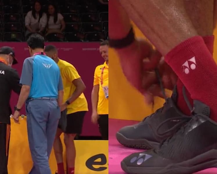 Malaysia's badminton coach Hendrawan lends shoes to rival player during match at 2022 Commonwealth Games