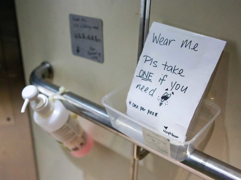 In the lifts of Block 267B Punggol Field, an anonymous resident placed a note, hand sanitiser and some surgical masks in containers that were emptied on Feb 4, 2020.