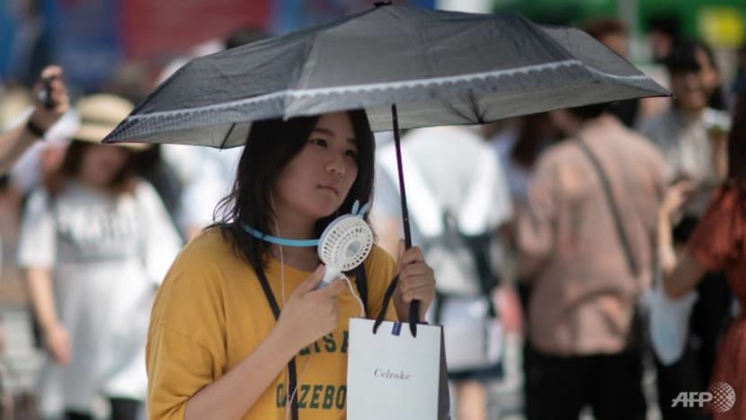 Tokyo experiments with water sprinklers to keep streets cool for Olympics