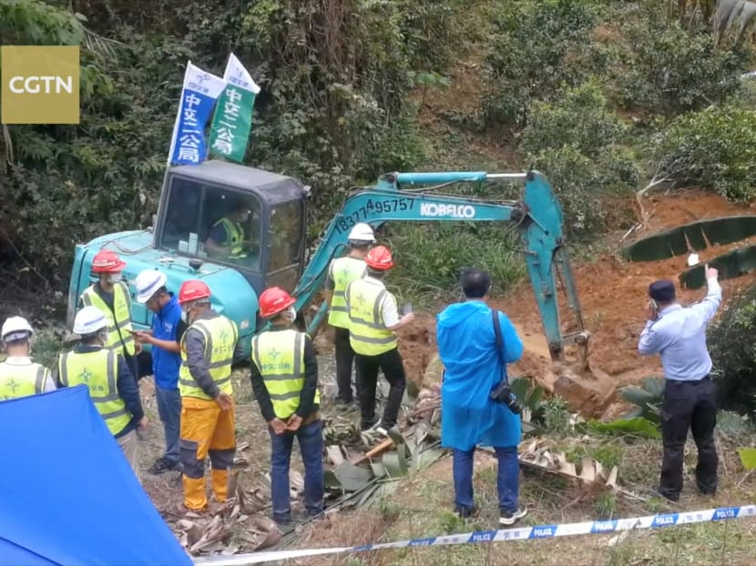Rescuers work at the site where a China Eastern Airlines Boeing 737-800 plane, flight MU5735, crashed in Wuzhou,China, on March 22, 2022.