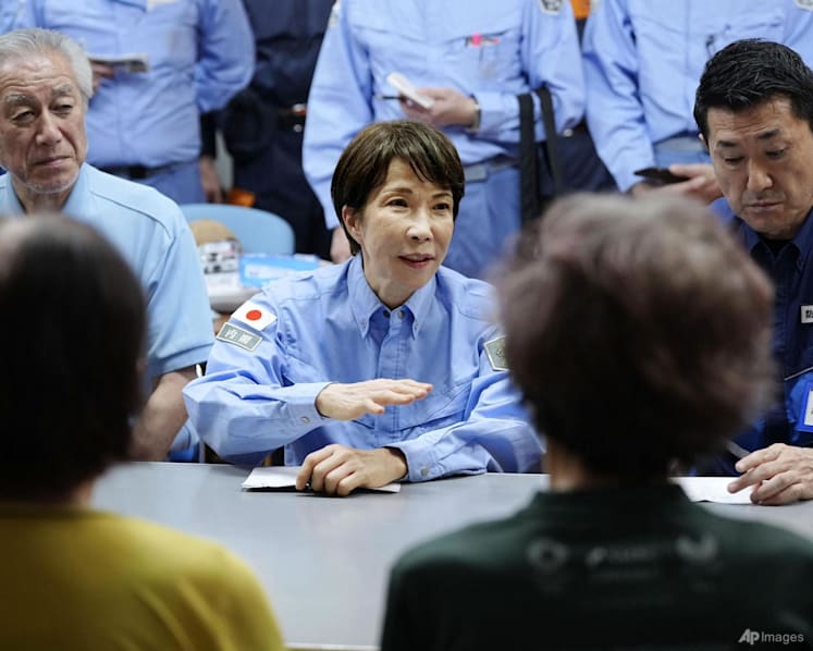 Japanese PM Takaichi visits quake-hit southern region as cleanup begins in intense heat