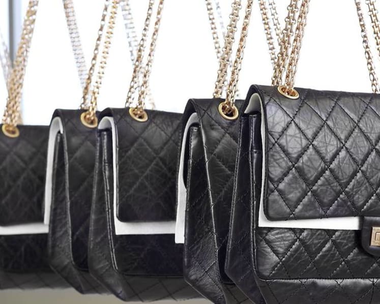 What makes that designer handbag so expensive?