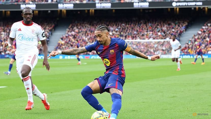 Raphinha hat-trick fires Barcelona past Sevilla to stay top