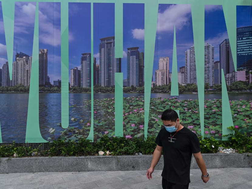 A man walks past a Wuhan sign, in China’s central Hubei province on Monday, Sept 28, 2020.