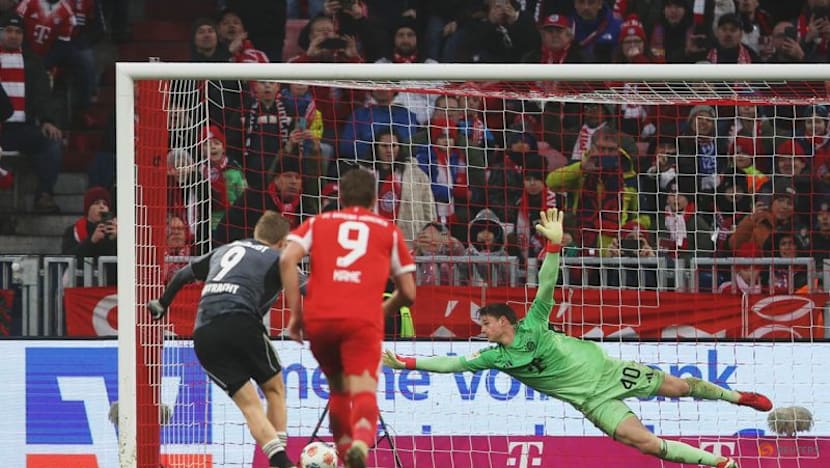 Kane double sends Bayern nine points clear after late Frankfurt scare