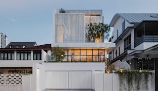 Behind the mysterious white facade of this Singapore house lies a warm, light-filled home