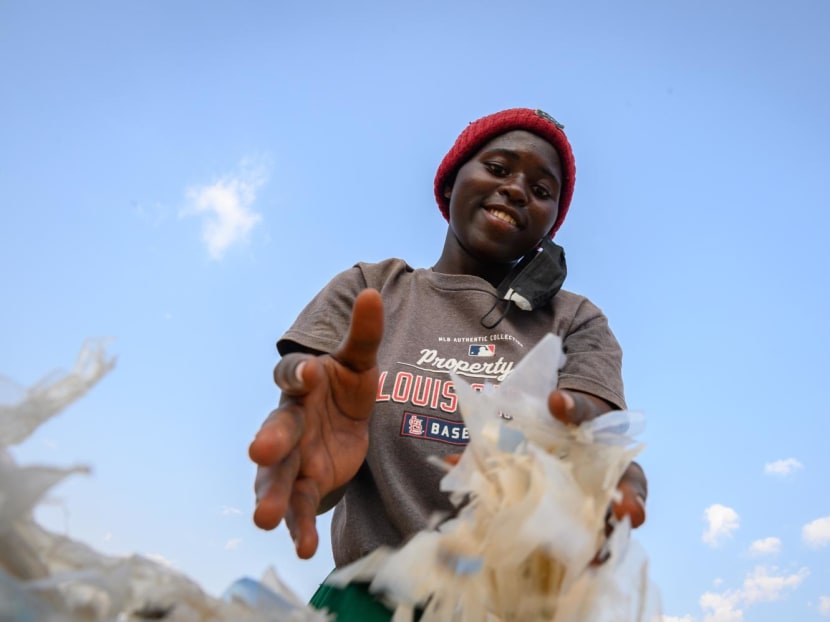 Honolyne Bisengimana, 16, works at the AgroPlast recycling plant. She works the afternoon shift for seven hours, helping to sort plastic waste manually and washing the sheets using rainwater. Honolyne Bisengimana, 16, works at the AgroPlast recycling plant. She works the afternoon shift for seven hours, helping to sort plastic waste manually and washing the sheets using rainwater.