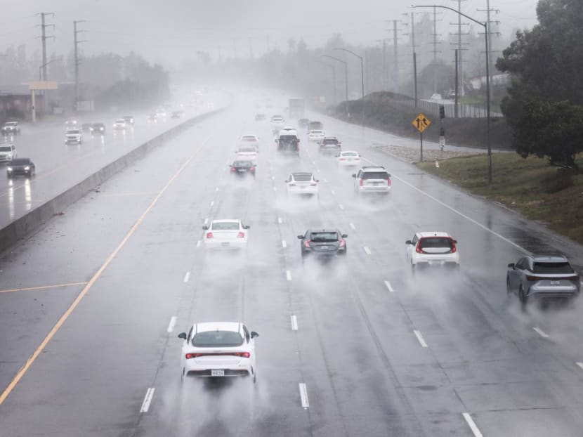Cars drive in the rain during a heavy rain storm in Agoura Hills, California, US, Feb 4, 2024. 