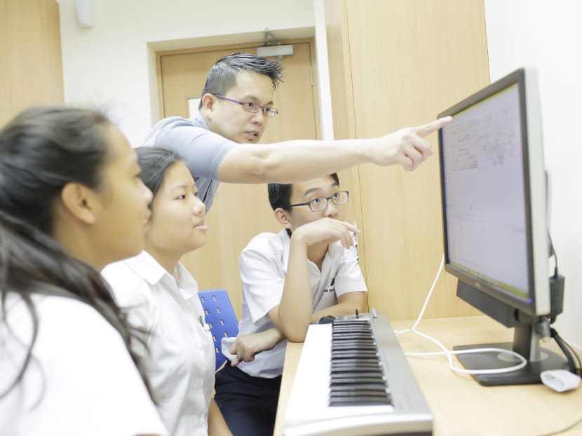 Undated photo of music teacher Philip Tan instructing his students. Photo: ACS International