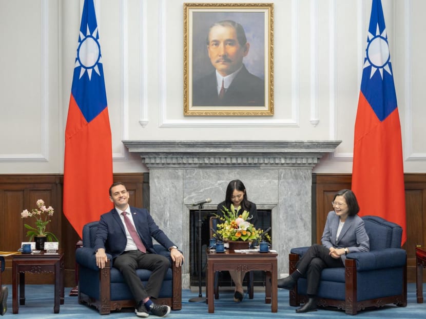 This handout picture taken and released by the Taiwan Presidential Office on Feb 22, 2024 shows President Tsai Ing-wen (R) speaking with US representative Mike Gallagher (L) at the Presidential Office in Taipei.