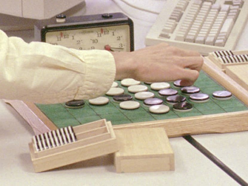 In this Aug 4, 1997, file photo, Takeshi Murakami, the world Othello champion from Tokyo, Japan, makes a move during his first game against a computer at the NEC Research Institute in South Brunswick, N.J. Photo: AP
